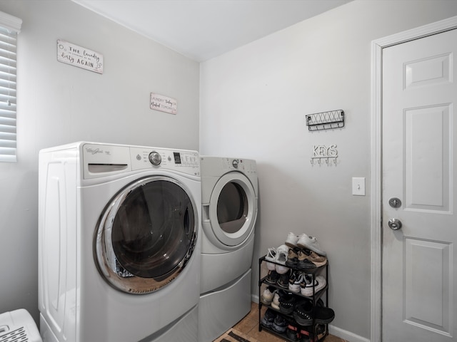 washroom with washing machine and clothes dryer