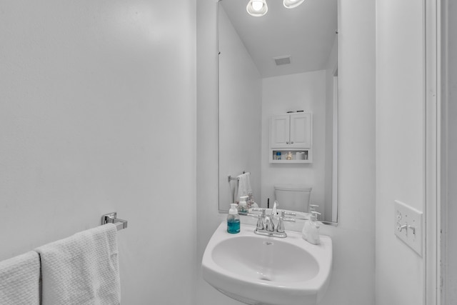 bathroom with sink and toilet