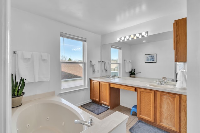 bathroom with vanity, a tub to relax in, and tile patterned floors