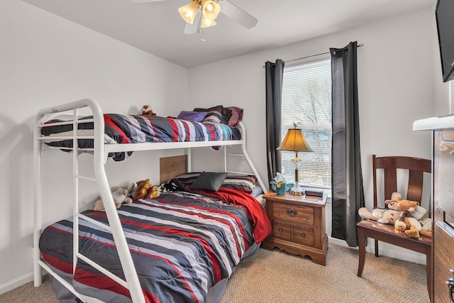 bedroom featuring light carpet, multiple windows, and ceiling fan