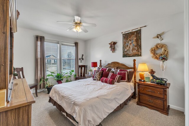 bedroom with light colored carpet and ceiling fan