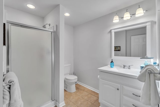 bathroom featuring vanity, toilet, and walk in shower