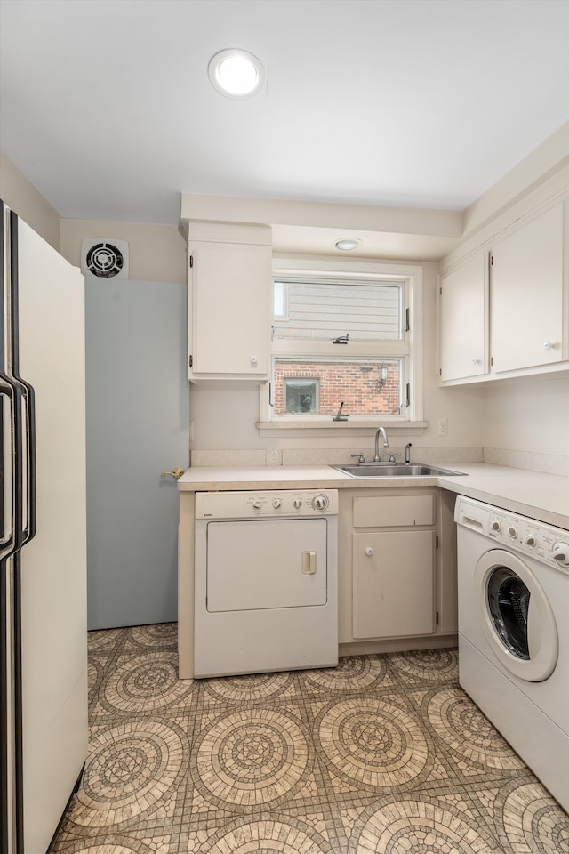 washroom with sink and washer / dryer