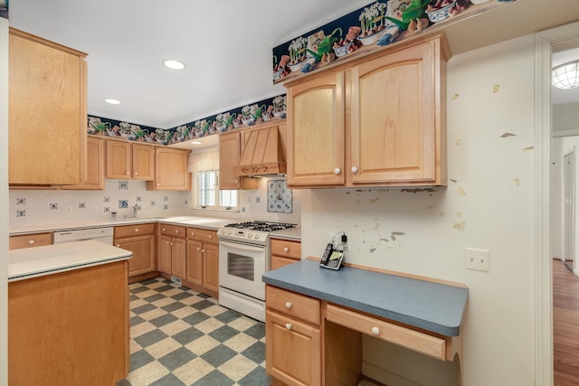 kitchen featuring white appliances, light brown cabinets, and premium range hood