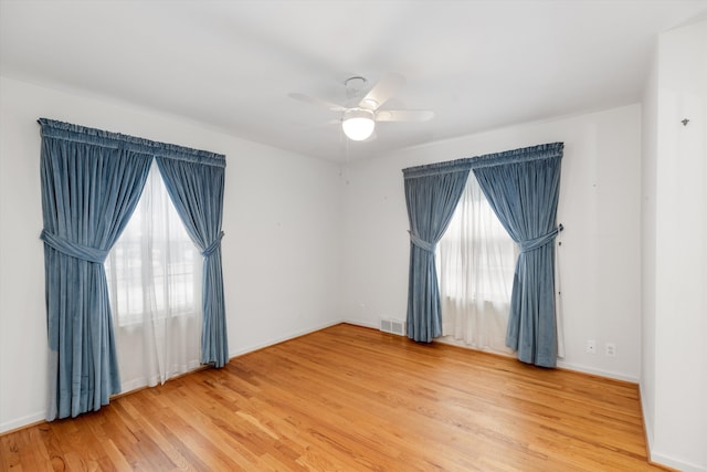 unfurnished room with ceiling fan and wood-type flooring