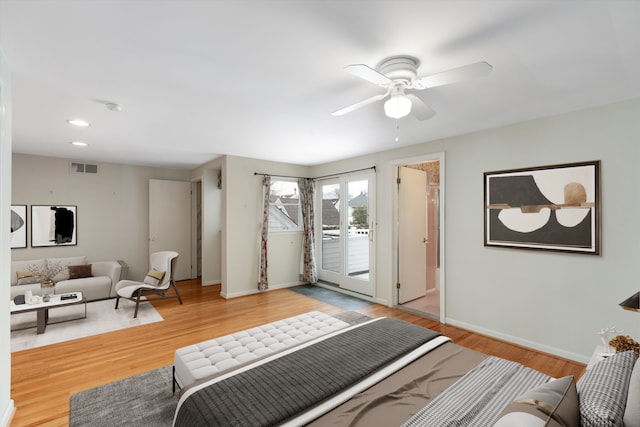 bedroom featuring access to exterior, wood-type flooring, and ceiling fan