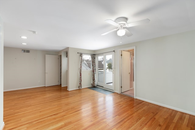 spare room featuring ceiling fan and light wood-type flooring