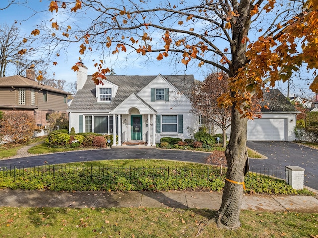 new england style home with a garage