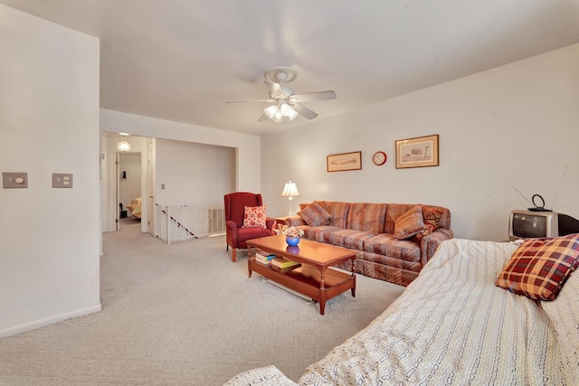 living room featuring ceiling fan and light carpet