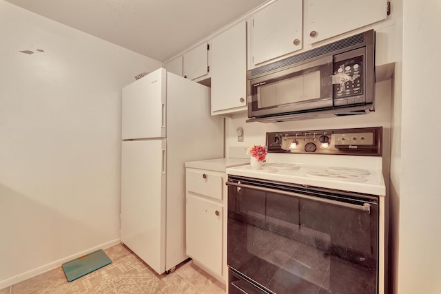 kitchen with white cabinetry and white appliances