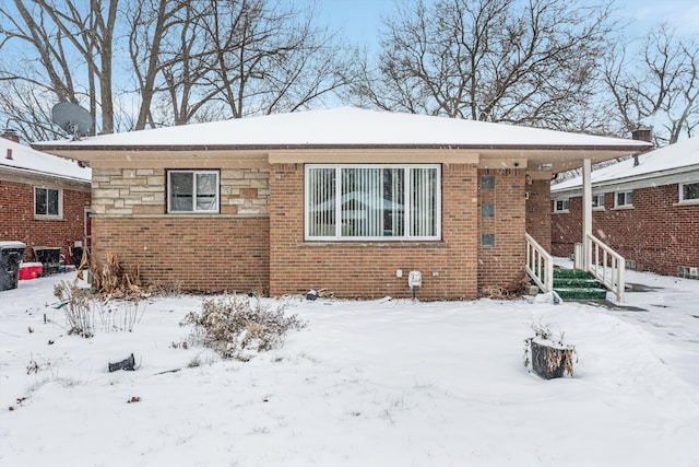 view of snow covered house