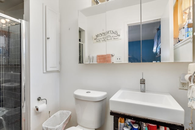 bathroom featuring walk in shower, sink, and toilet