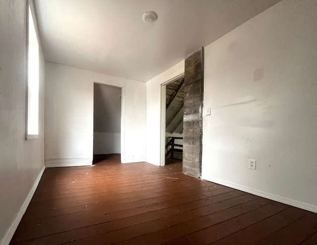 empty room with dark hardwood / wood-style floors