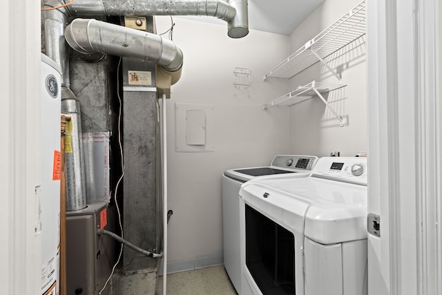 clothes washing area featuring washing machine and clothes dryer and electric panel