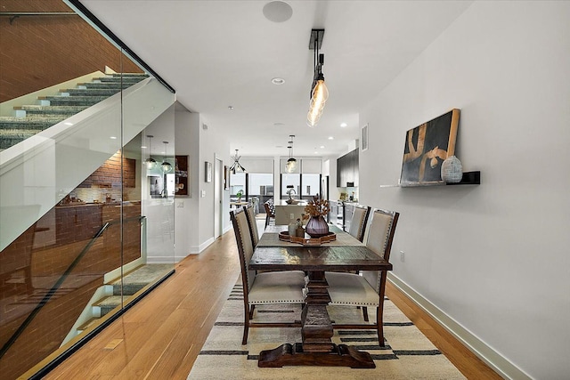 dining area with hardwood / wood-style flooring