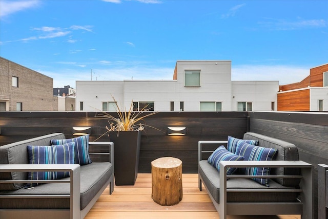 wooden terrace featuring outdoor lounge area