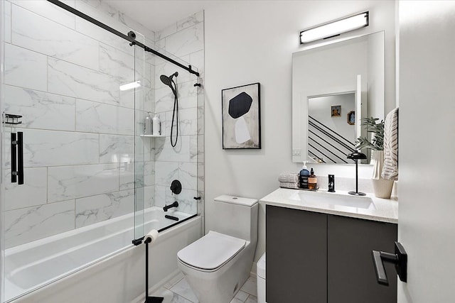 full bathroom with vanity, bath / shower combo with glass door, and toilet