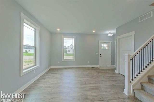 entrance foyer with light hardwood / wood-style floors