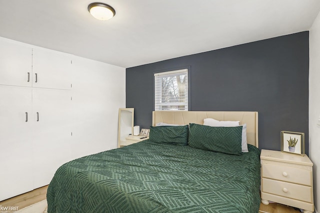 bedroom with hardwood / wood-style floors