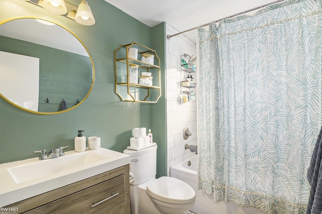 full bathroom with vanity, shower / bath combo, and toilet