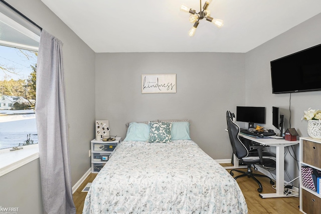 bedroom with hardwood / wood-style floors