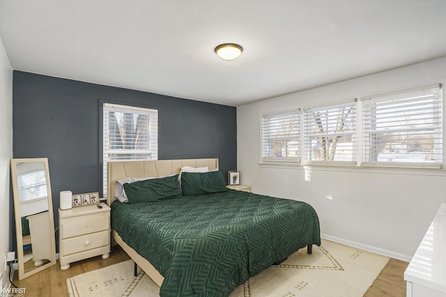 bedroom with light wood-type flooring