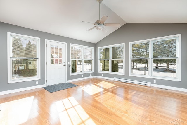 unfurnished sunroom with a baseboard heating unit, vaulted ceiling, and ceiling fan