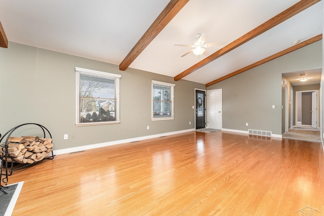 unfurnished living room featuring vaulted ceiling with beams, ceiling fan, and light wood-type flooring