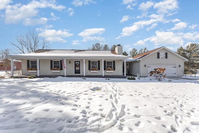 view of front of property with a porch and a garage