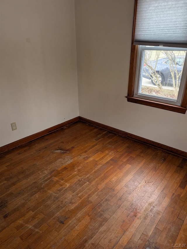 spare room featuring dark hardwood / wood-style flooring