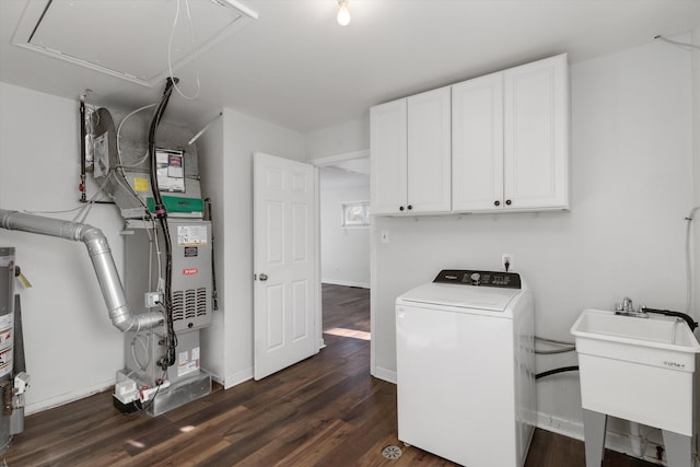 laundry area featuring cabinets, dark hardwood / wood-style flooring, washer / dryer, and sink