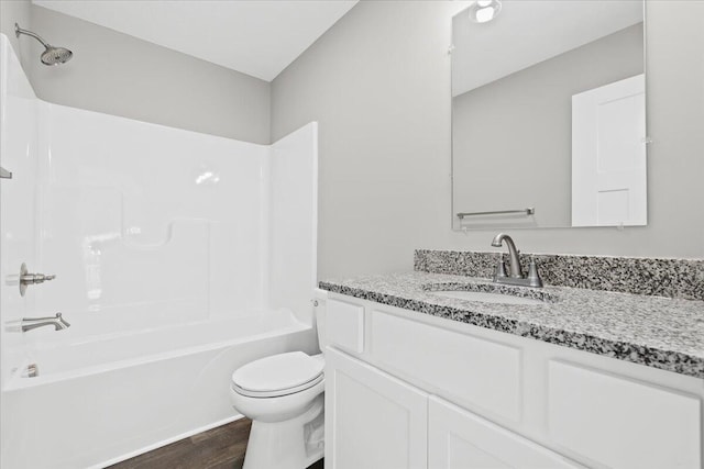 full bathroom featuring shower / tub combination, wood-type flooring, toilet, and vanity