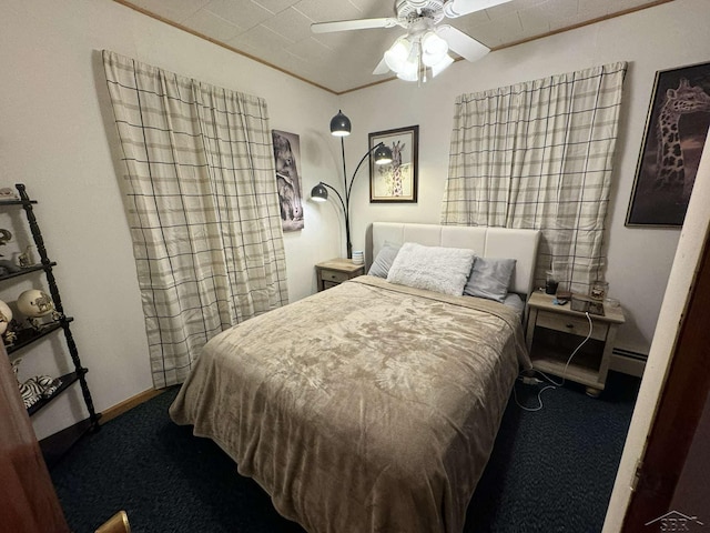 carpeted bedroom with ornamental molding, a baseboard radiator, a ceiling fan, and baseboards