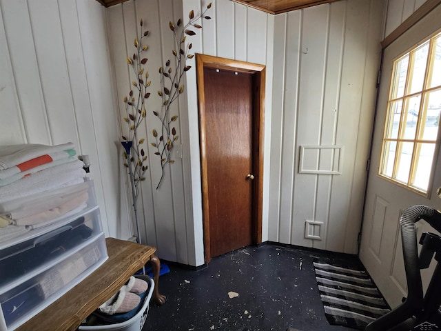 interior space featuring wood walls