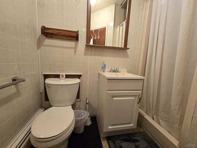 full bathroom featuring a baseboard heating unit, a shower with curtain, toilet, tile walls, and vanity