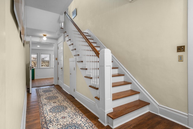 staircase featuring hardwood / wood-style flooring