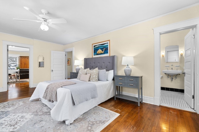 bedroom with dark hardwood / wood-style flooring, ornamental molding, ceiling fan, and ensuite bath