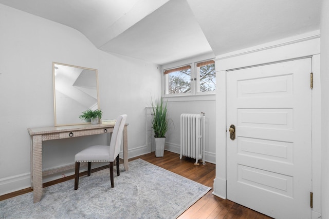 office featuring dark hardwood / wood-style flooring and radiator heating unit