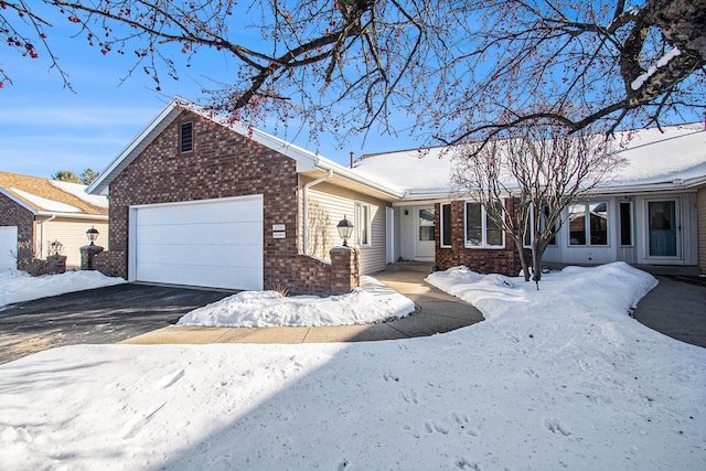 ranch-style house featuring a garage