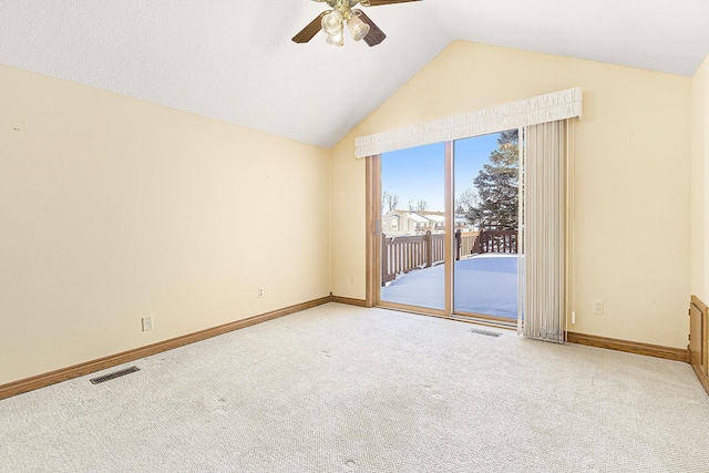 carpeted spare room with lofted ceiling and ceiling fan