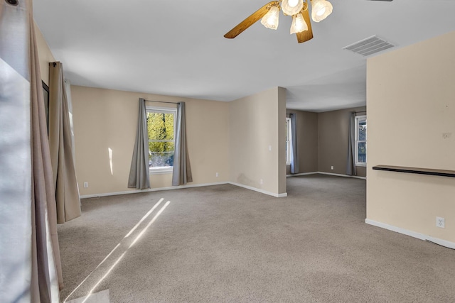 unfurnished room with carpet floors and ceiling fan