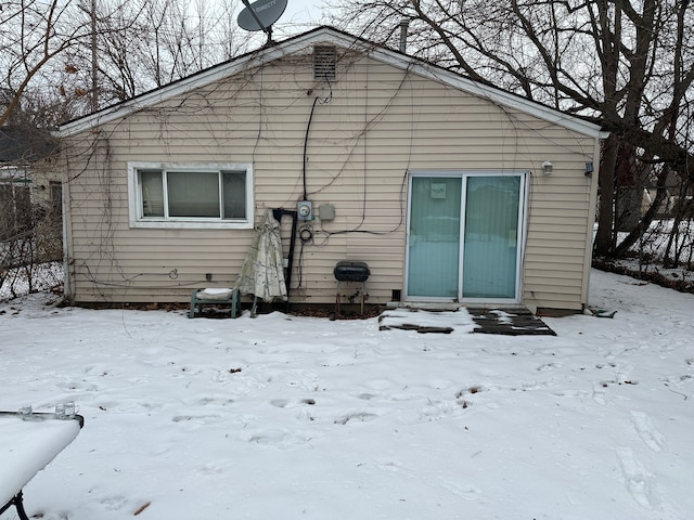 view of snow covered house