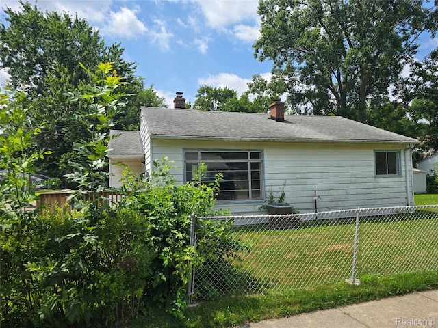 32004 Cheboygan, Westland, MI 48186 - view of home's exterior featuring a chimney