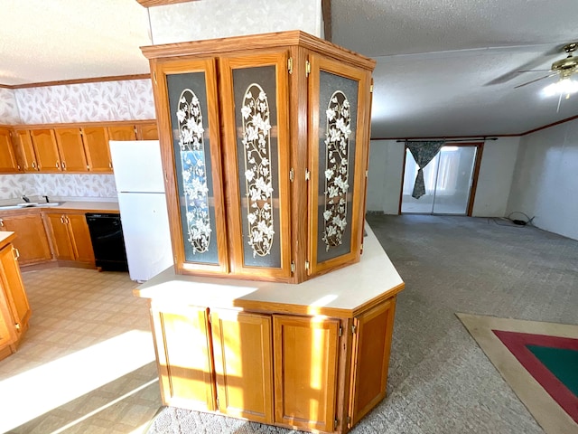 kitchen featuring sink, ceiling fan, black dishwasher, a textured ceiling, and white fridge