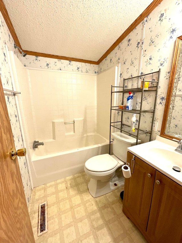 full bathroom with toilet, a textured ceiling, ornamental molding, vanity, and shower / bath combination