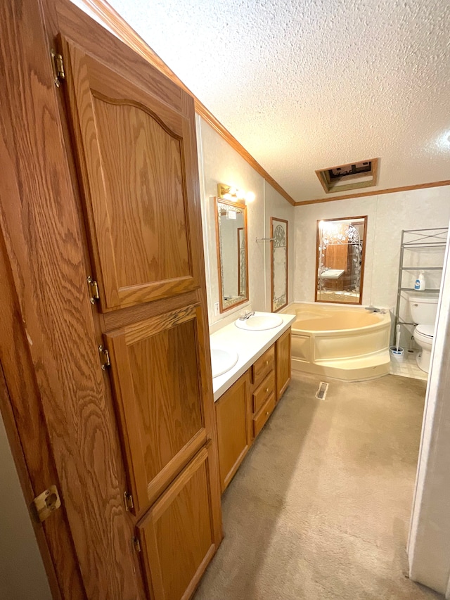 bathroom with crown molding, a bathtub, a textured ceiling, and toilet