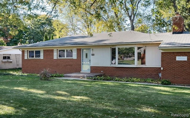 ranch-style home with a front yard