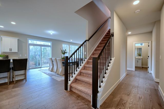 staircase featuring wood-type flooring