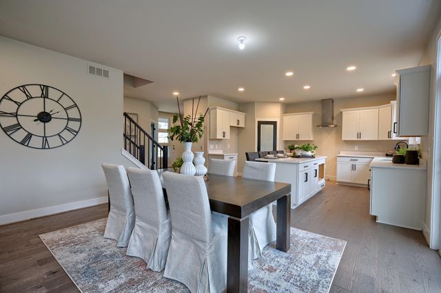 dining room with sink and light hardwood / wood-style floors