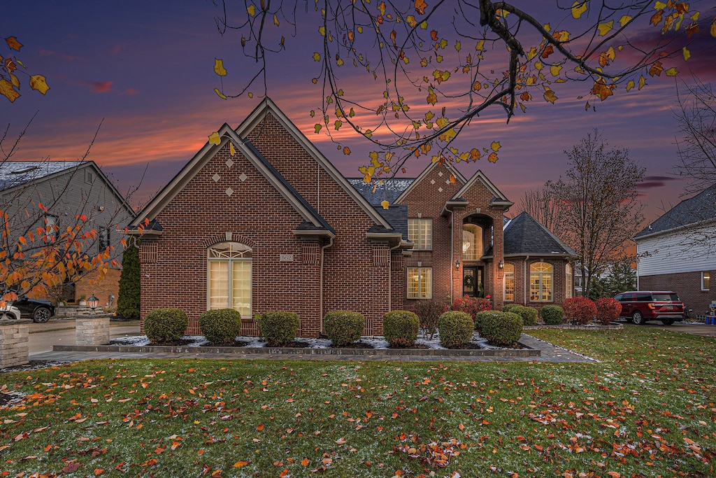 view of front of home with a lawn